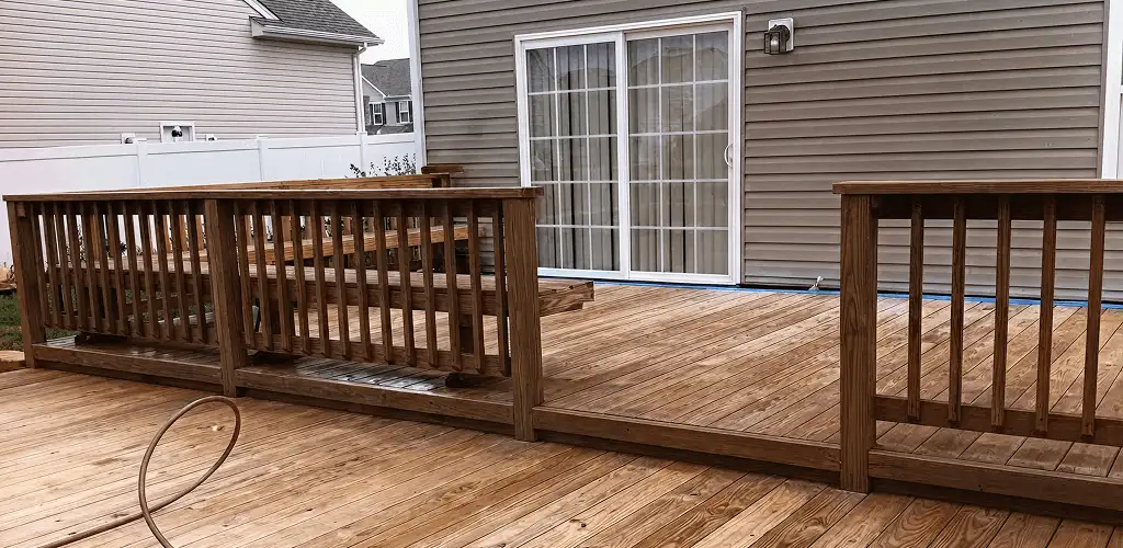 Deck sealing service protecting a backyard wood deck and railings in Irvine, CA