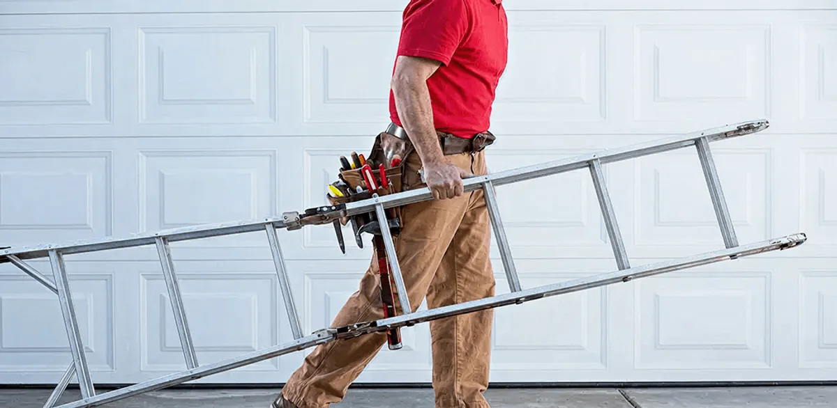 Garage door repair technician arriving with tools and ladder in Irvine, CA
