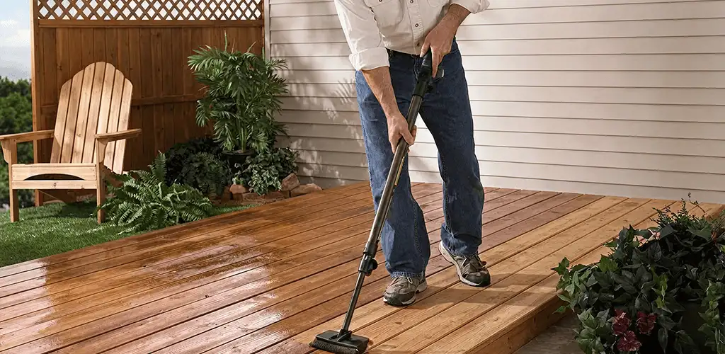 Deck staining service applying stain to a backyard wood deck in Irvine, CA
